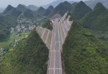 Trung Quốc xẻ núi làm đường cao tốc, dẫn thẳng tới cầu cao nhất thế giới